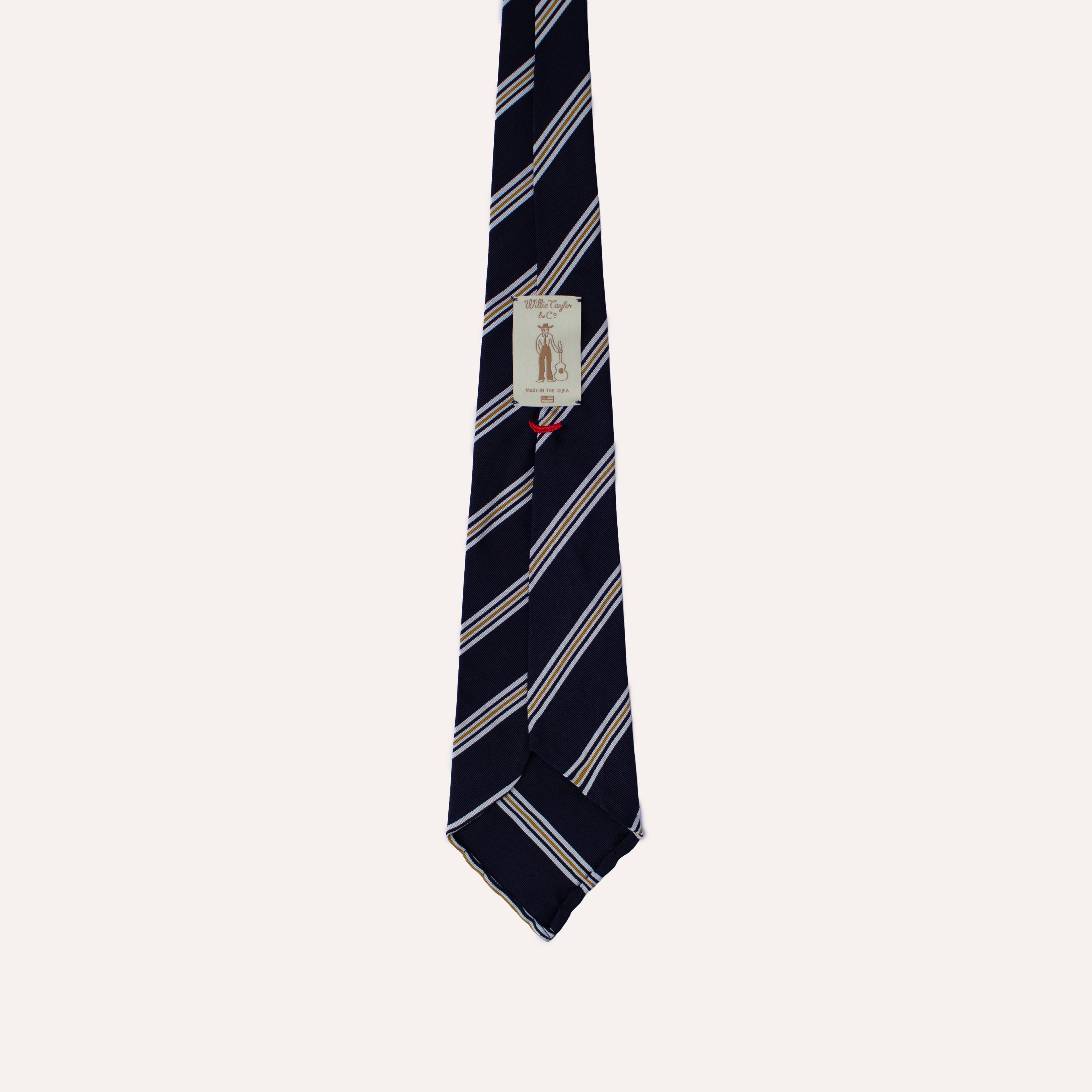 Corbata de seda Mogador enrollada a mano con rayas azules, blancas y amarillas