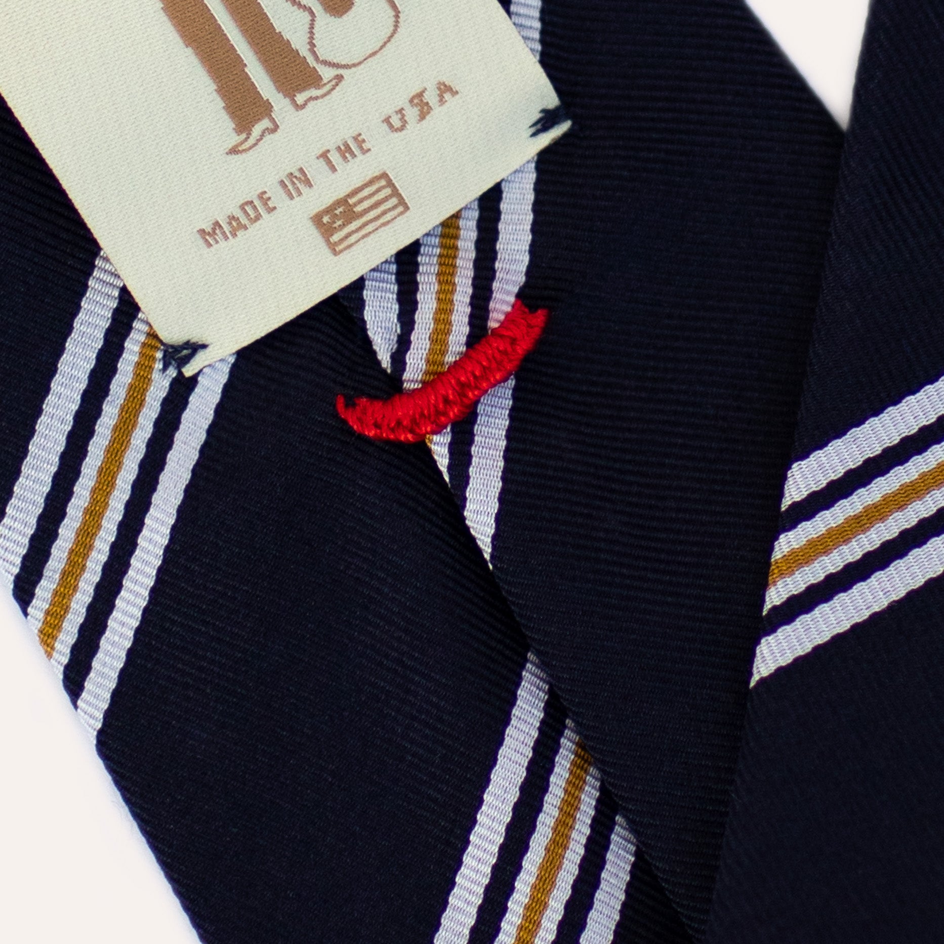 Corbata de seda Mogador enrollada a mano con rayas azules, blancas y amarillas