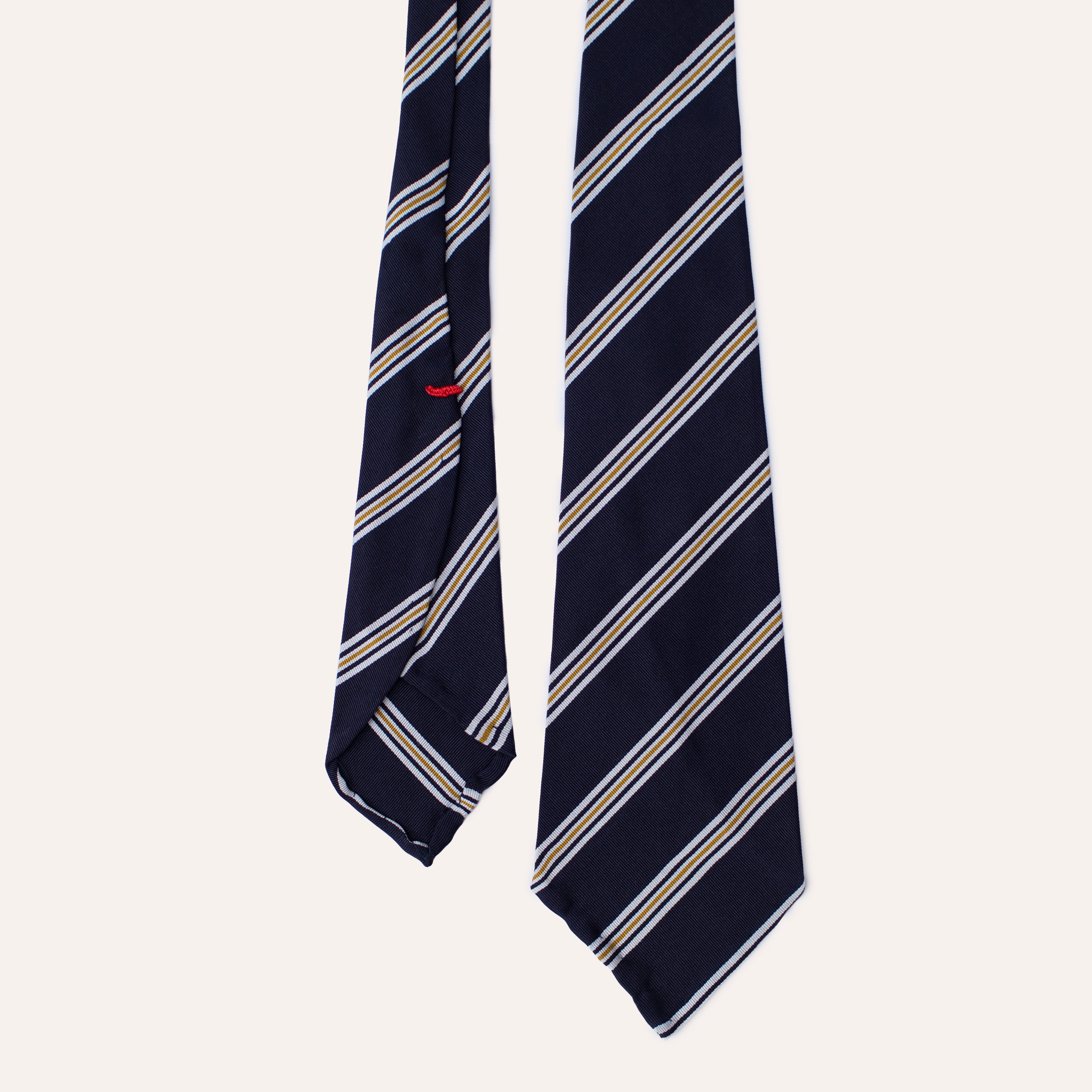 Corbata de seda Mogador enrollada a mano con rayas azules, blancas y amarillas